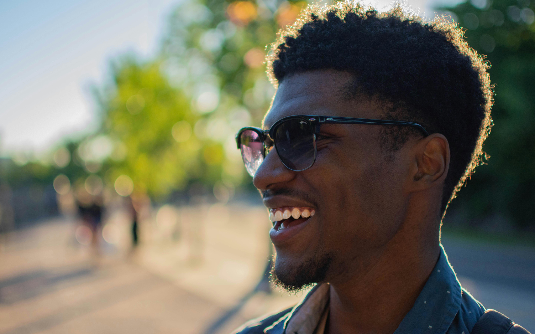 man smiling in the sun