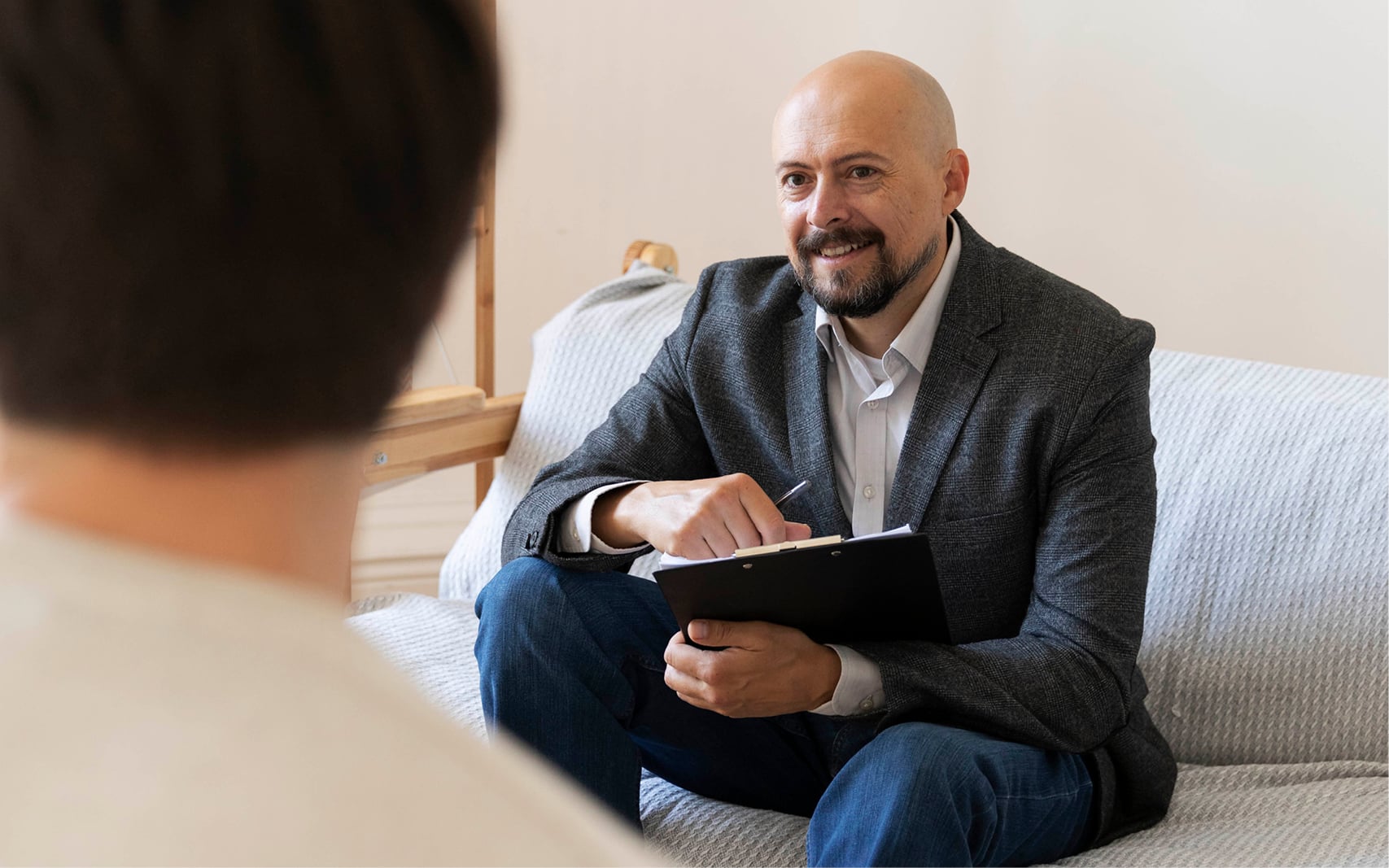 Professional looking man on a therapist couch 